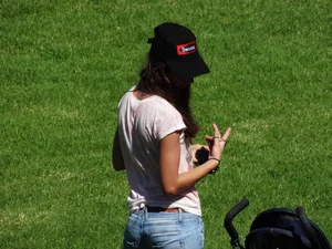 Skinny milf in tight jeans showing a bit of ass crack