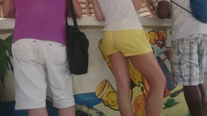 Milf in yellow shorts with vpl and a wedgie