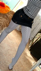 Teen Selfie in Mini Skirt and Fishnet Pantyhose