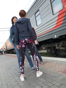 Skinny Teen With Nice Thin Legs in Spandex Tights Hugging Her Friends at a Railway Station Photos