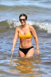 Frankie Bridge nip slips in a bikini on the beach