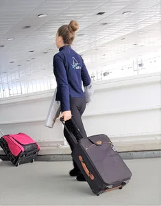 Girl With a Flat Ass in Tights Carrying a Suitcase at an Airport Creepshot