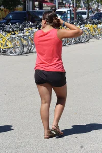 Thick girl in pink top and black shorts with vpl