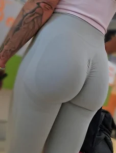 Fit blonde in grey leggings with a Fat Ass