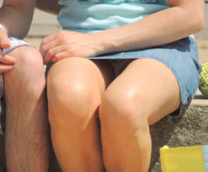 Brunette sitting upskirted showing her white lace panties