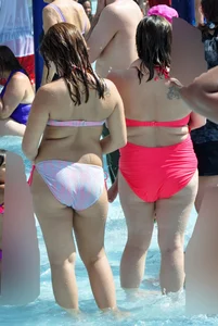 Two thick milfs at the pool in bikinis