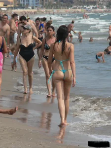 Bunch of sexy babes at the beach in thong bikinis