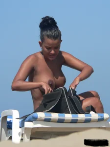 Hot ass topless beach girl with great tits lets her little brother oil up her ass in thong bikini