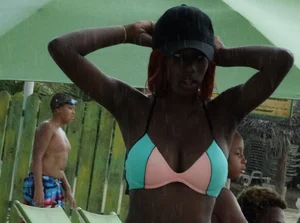 Candid black family, milf and teens on the beach in bikinis