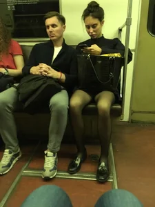 Sexy candid girl with slim legs wearing black pantyhose in a subway train creepshot