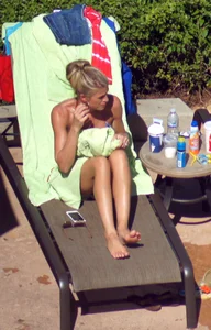 Blonde babe at the pool with sexy body in USA bikini