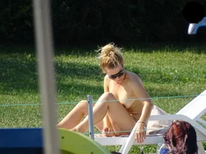 Topless lady at the pool with nice tits