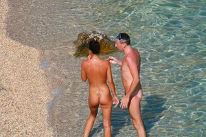 Ula FKK Sexy brunette on a nude beach topless, bottomless and with blue thong