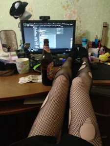 Sexy Legs in Torn Fishnet Pahtyhose on the Desk Home Selfie