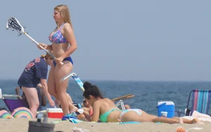 3 girls on the beach in bikinis with big boobs, one brunette and two blondes