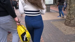 Pretty redhead girl with a nice ass in tight jeans walking with her boyfriend