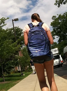 Hot college girl in little jean shorts showing some cheeks and legs