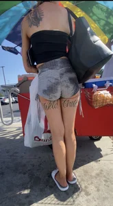 Milf with cheeks out and “Wild” tattoo