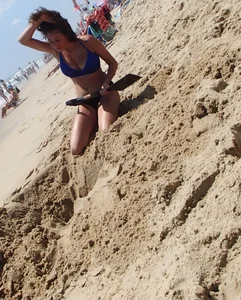 Girl with great tits playing in the sand at the beach