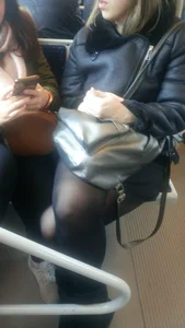 Crossed Legs in Black Pantyhose in a Public Train