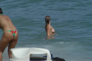 Topless girls on a beach in Barcelona