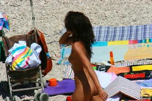 Ula FKK Sexy brunette on a nude beach topless, bottomless and with blue thong