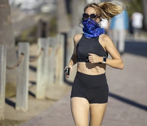 Skinny jogger girl in a top and spandex shorts street creepshot