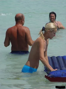 Beach voyeur girls in bikinis, thongs and topless