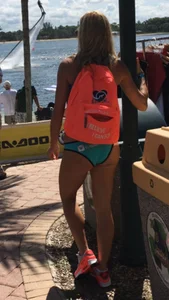 Candid Teen in a Swimsuit And Pink Sneakers With a Backpack