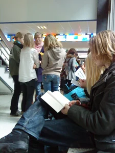 Teen with a skinny booty in blue jeans