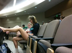 Girl with Hot Skinny Legs Sitting Barefoot in a Conference Hall Candid