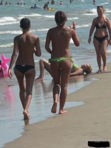 Bunch of sexy babes at the beach in thong bikinis