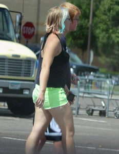 Blonde girl in glasses with a thick booty in green shorts