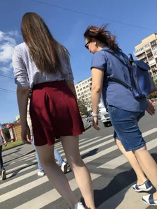 Girl in a Skirt with Sexy Skinny Legs on the Crosswalk Candid Photos