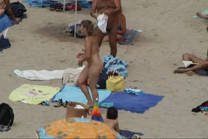 Girls on a nude beach in Sitges, Spain
