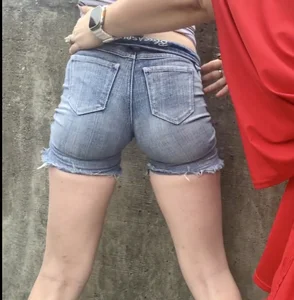 Tight ass in grey jean shorts.