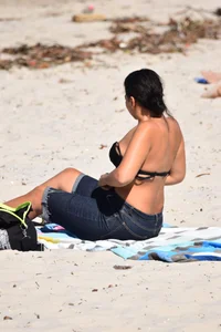 Thick mature brunette bikini lady on the beach with a nice body