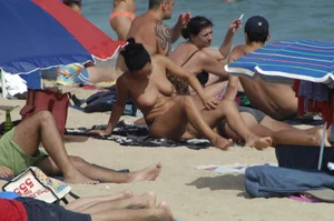 Topless girls on a beach in Barcelona