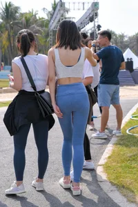 Hula hooping skinny Asian in light blue leggings with vpl