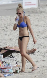 Florida blonde in blue and black bikini on the beach