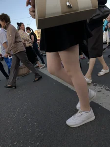 Candid girl wearing a short skirt crossing the street, awesome pale legs