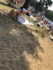 Skinny Girl Undressing on the Lake Beach