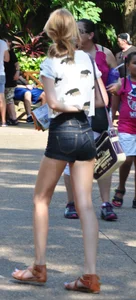 Skinny blonde chick in little denim shorts