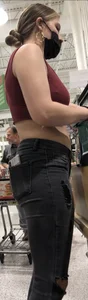 Latina in Maroon crop top and tight black jeans