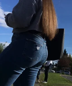 Long haired beauty teen with a tight ass in jeans