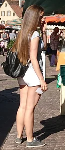 Pretty blonde babe with nice legs in white denim shorts