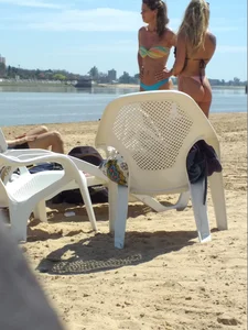 Blonde beach girl with a great ass in pink thong bikini