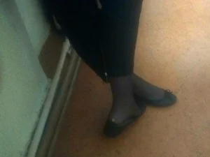 Teen’s Feet in Flats and Black Pantyhose Closeup