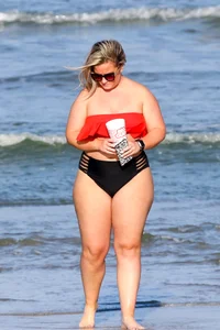 Thick BBW blonde lady in a bikini at the beach