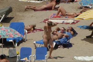 Girls on a nude beach in Sitges, Spain